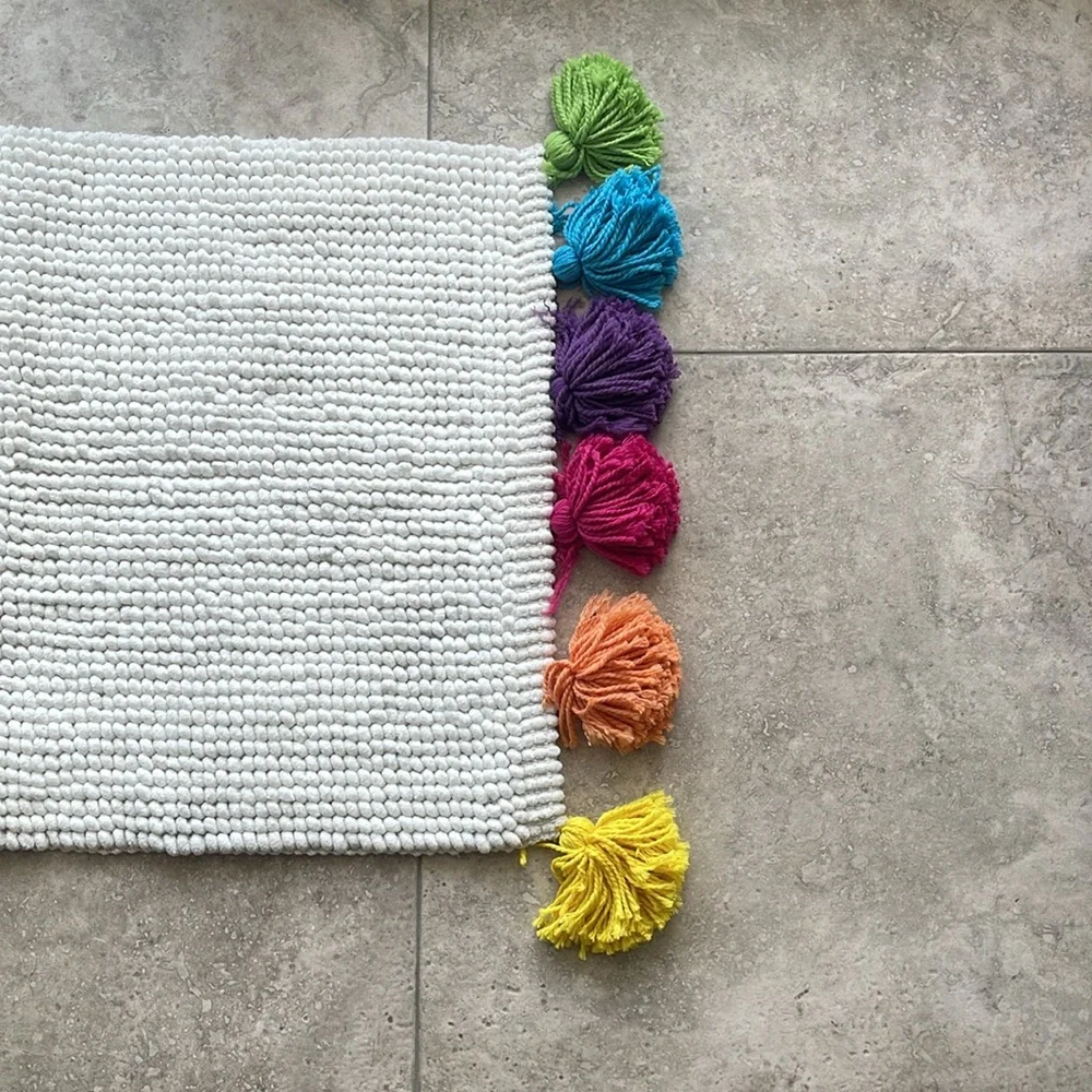 Pom Pom floor mat. NWOT. Never used. Non smoker home.